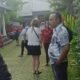 Police officers assist in evacuating an American tourist from a villa in Ketewel, Gianyar.