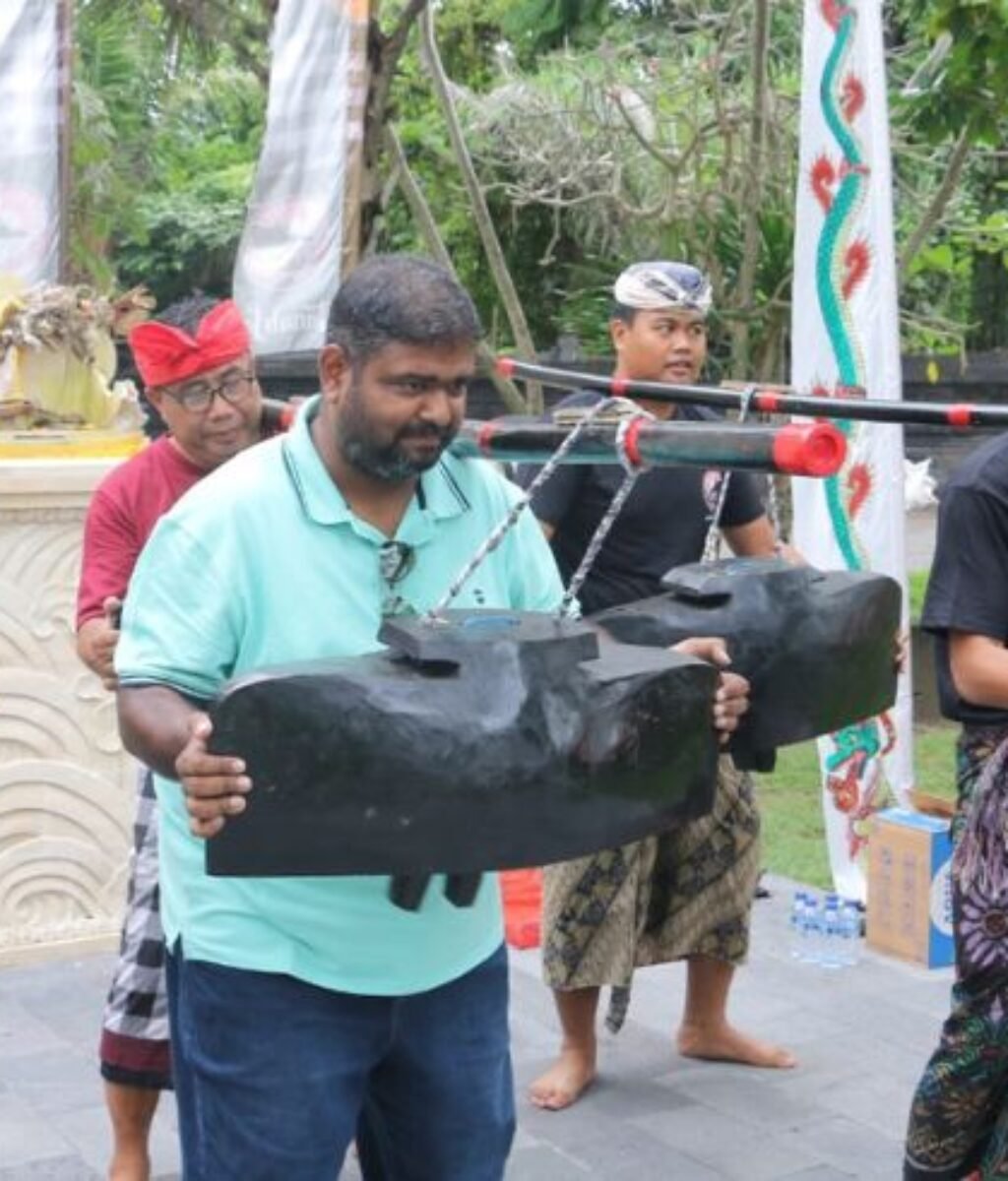 Tourists join locals in a lively open rehearsal of the Okokan and Tektekan cultural performance at Tanah Lot. Tourists join locals in a lively open rehearsal of the Okokan and Tektekan cultural performance at Tanah Lot.