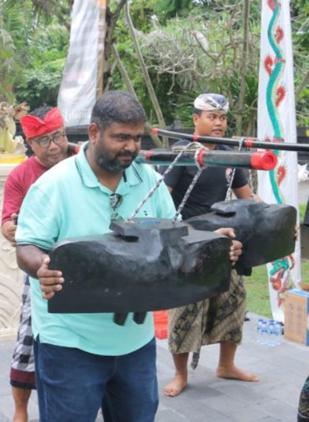 Tourists join locals in a lively open rehearsal of the Okokan and Tektekan cultural performance at Tanah Lot. Tourists join locals in a lively open rehearsal of the Okokan and Tektekan cultural performance at Tanah Lot.